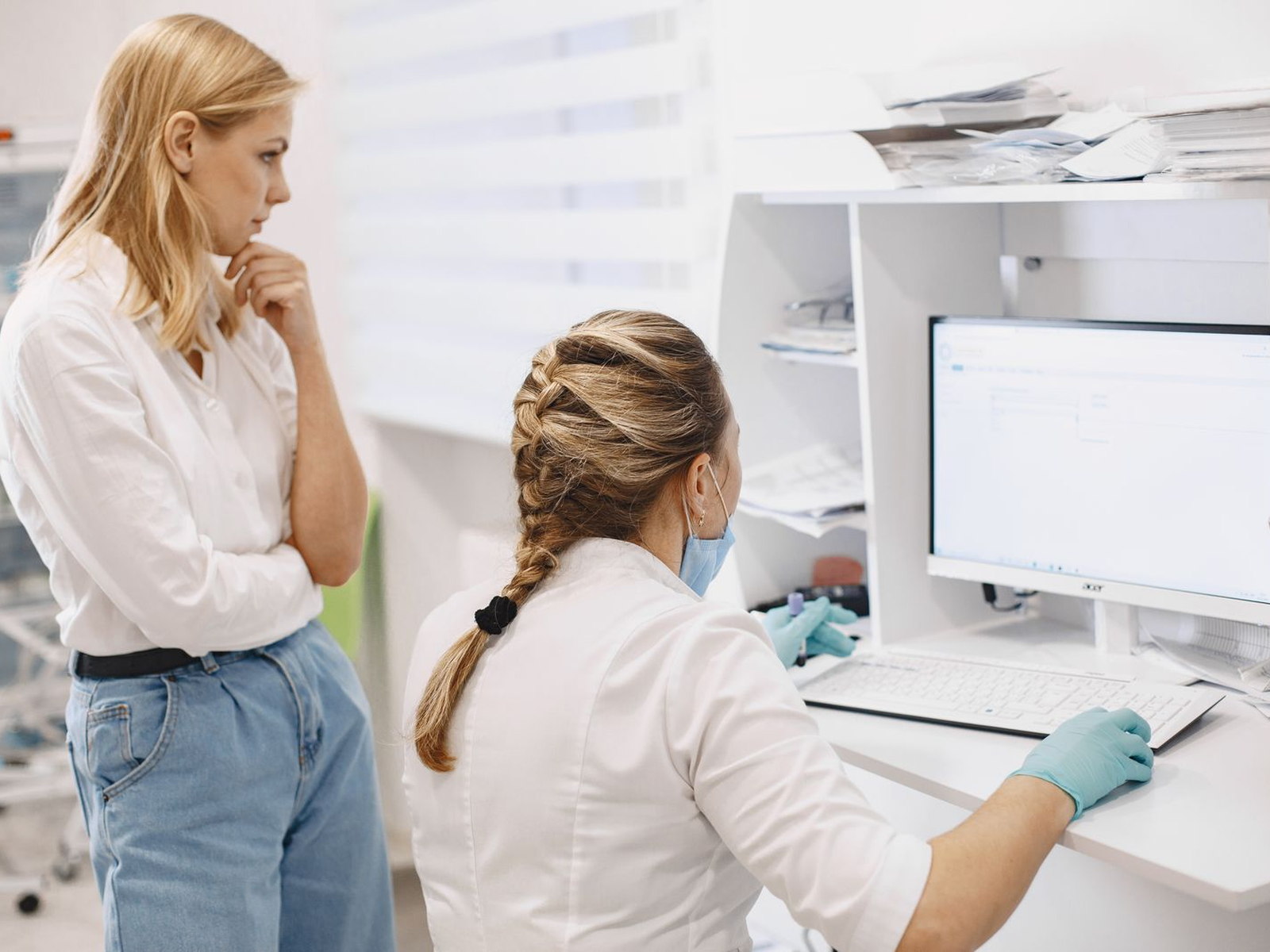 Medical practice staff using a computer during daily clinic operations