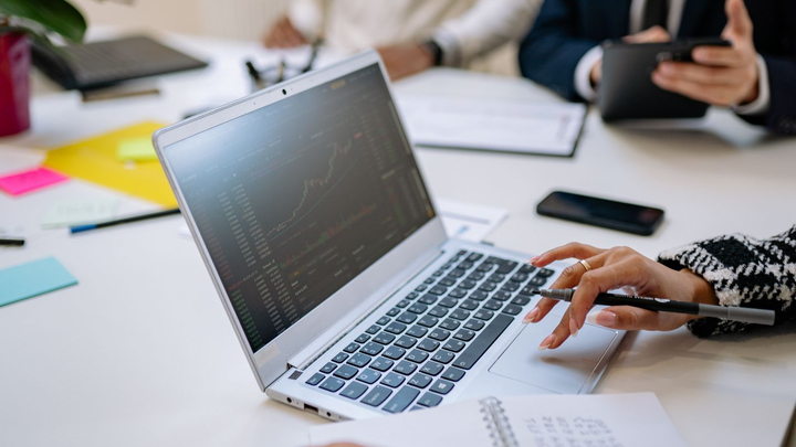 Business leaders reviewing technology plans during an IT consulting meeting