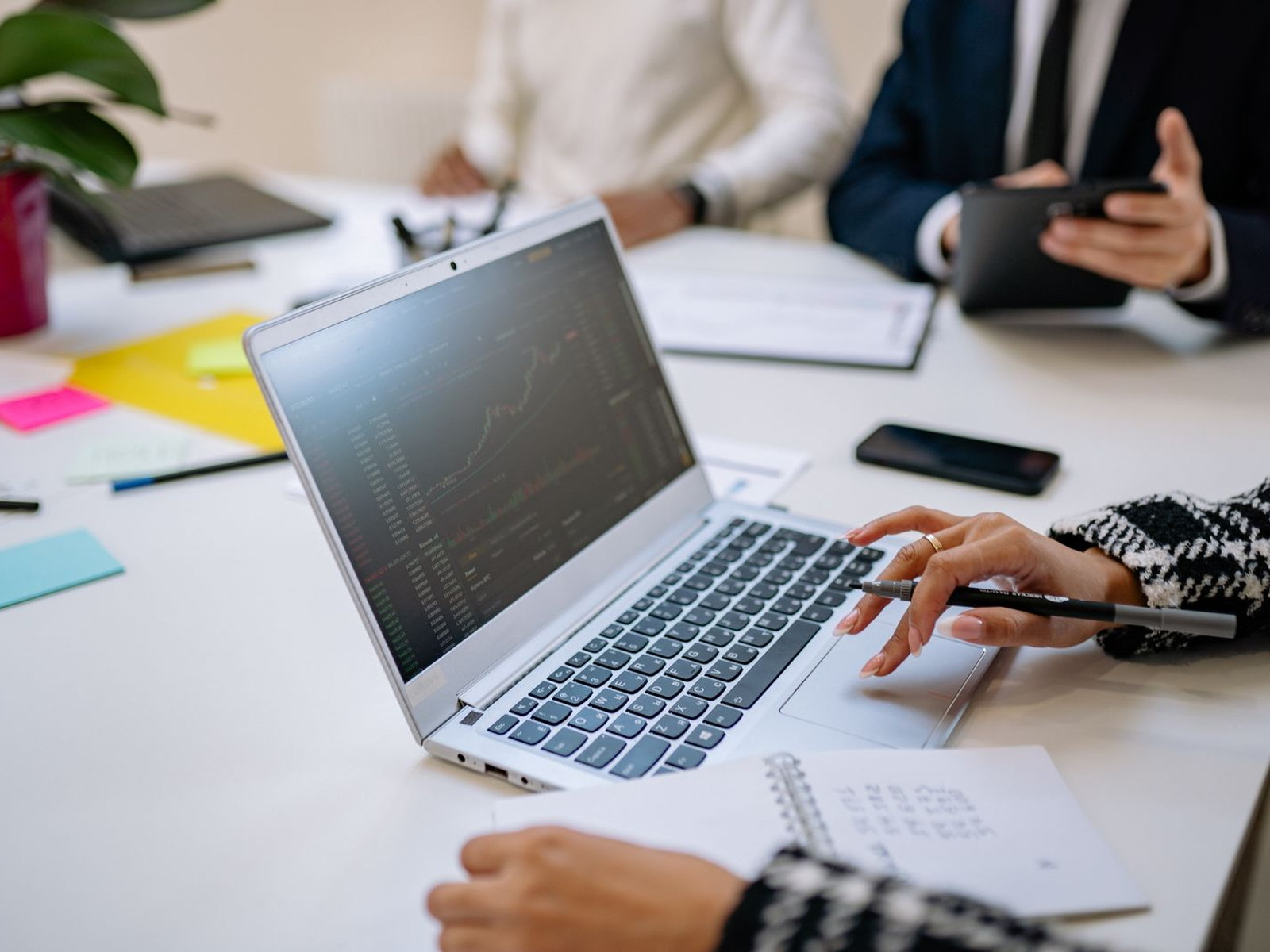 Business leaders reviewing technology plans during an IT consulting meeting