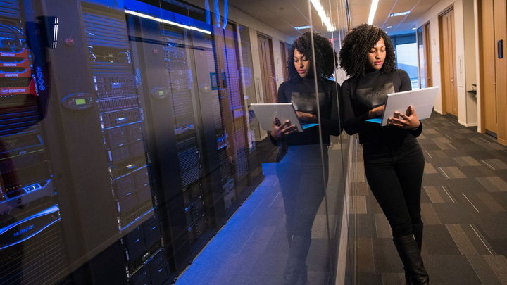 Cybersecurity professionals reviewing systems in a secure data center