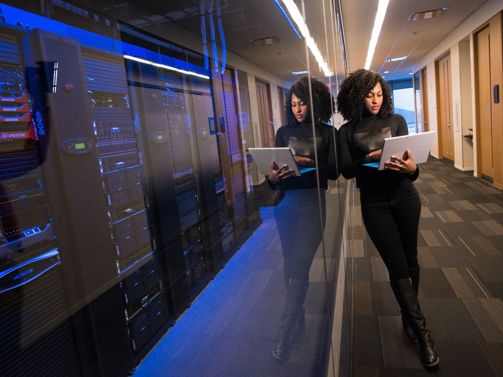 Cybersecurity professionals reviewing systems in a secure data center